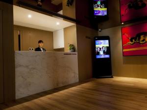TV a/nebo společenská místnost v ubytování Inn Hotel Macau