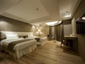 Postel nebo postele na pokoji v ubytování Inn Hotel Macau + 24 fotografií