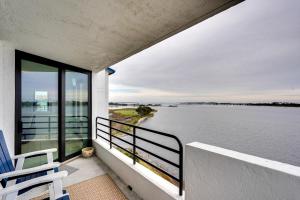 a balcony of a house with a view of the water at Florida Apartment with Balcony, Pool Access and Views in Panama City Beach