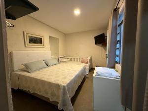 En eller flere senge i et værelse på Pousada Recanto da Estação + 126 billeder