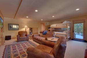 a living room with a couch and a bunk bed at Sundance Lodge -Mountain Home w Views of Palisades - Ski Shuttle, Pets okay! in Olympic Valley