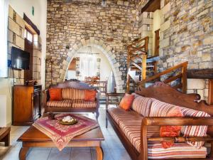 a living room with a couch and a table at Falasarna Villas in Falasarna