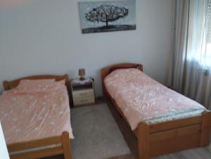 Postel nebo postele na pokoji v ubytování Vila Mihajlovic