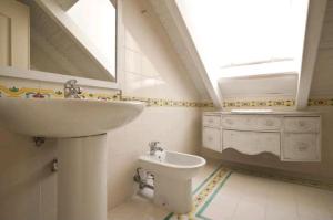 a bathroom with a sink and a toilet at Casa Vacanza Saint Patrick DImora del 1200 in Barletta +76 photos