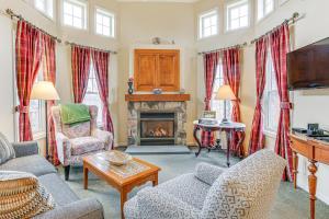 a living room with two couches and a fireplace at Spacious Condo with View Less Than 1 Mi to Mtn Creek Resort! in Vernon Township