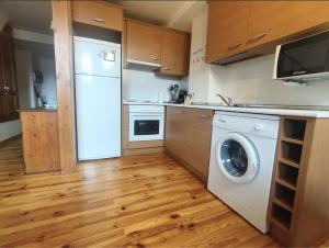 Kuchyň nebo kuchyňský kout v ubytování CHECK-IN CASAS Casa Puntarron