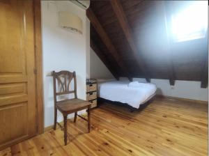 Postel nebo postele na pokoji v ubytování CHECK-IN CASAS Casa Puntarron