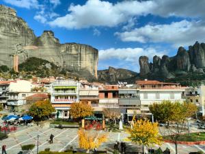 a city with a mountain in the background at Meteora Scenic Loft in Kalabaka