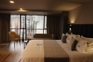 Voodi või voodid majutusasutuse Giluxe Hotel toas