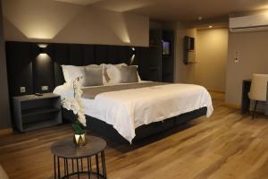 Voodi või voodid majutusasutuse Giluxe Hotel toas