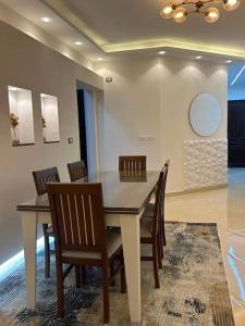 a dining room with a table and chairs at New furnished apartment in Cairo