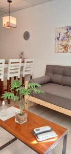 a living room with a couch and a table at DEPARTAMENTOS SAAVEDRA dto 3 y 4 in Viedma