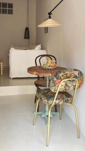 a table and chairs with a bed in the background at Casa Petita, Villajoyosa in Villajoyosa