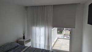 Ένα ή περισσότερα κρεβάτια σε δωμάτιο στο Departamento a estrenar zona Constitución y la costa a metros del mar con cochera