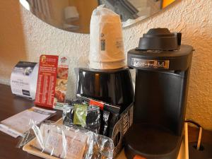 a coffee maker with a bag on top of it at Super 8 by Wyndham Elizabethtown in Elizabethtown