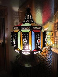 a colorful light hanging on a wall at Riad Les Chtis D'Agadir in Agadir