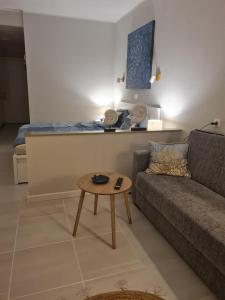a living room with a couch and a table at Apartment Casa M in Morro Jable in Morro del Jable