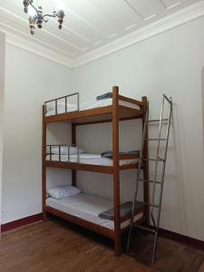 a room with two bunk beds in a room at É Hostel - Guesthouse in Ouro Preto