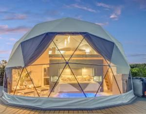 a dome tent with a house inside of it at No name in Hye