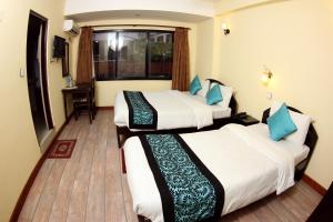 Letto o letti in una camera di Bag Packer's Lodge