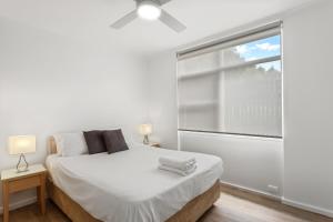 Postel nebo postele na pokoji v ubytování Taft Apartments