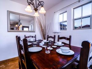 a dining room with a wooden table and a mirror at Gorgeous San Felipe Rental Condo in Playa El Paraíso +27 photos