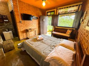 Postel nebo postele na pokoji v ubytování Alecrim Pousada