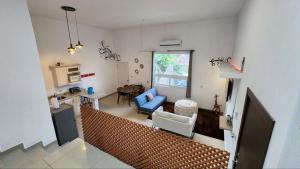 a living room with a blue couch and a table at LA VILLA by luxury Attilan in San Pedro La Laguna