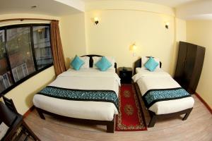 Letto o letti in una camera di Bag Packer's Lodge