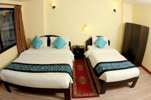 Letto o letti in una camera di Bag Packer's Lodge
