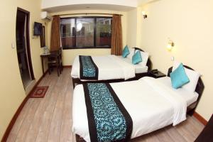 Letto o letti in una camera di Bag Packer's Lodge