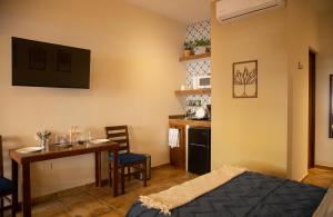 a room with a kitchen and a table and a dining room at Estancia 102 in La Paz