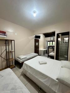 Ein Bett oder Betten in einem Zimmer der Unterkunft Hotel D'Luz
