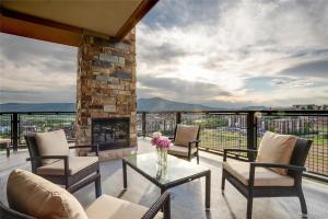 a living room with a fireplace and a glass table at Edgemont 2301 Luxury Condo with Backdoor Ski-In Ski-Out Access! in Steamboat Springs