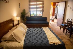 a bedroom with a bed and a large window at Estancia 103 in La Paz