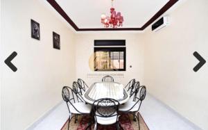 a dining room with a table and chairs at Authentic Targa Villa with a Private Pool No overlooking in Marrakech