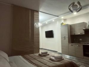 a bedroom with a bed with two pillows on it at Campania Apartment Pompei Luxury - 150m dalla stazione - 5km da Pompei in Poggiomarino