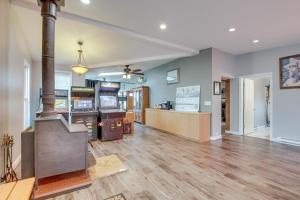 a large room with arcade games and consoles at Spacious Sheboygan Home with Grill and Fire Pit! in Sheboygan