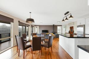 a kitchen and dining room with a table and chairs at Florida Bliss in Smiths Beach