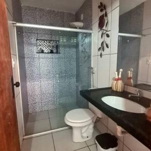 a bathroom with a shower and a toilet and a sink at Casa linda na Praia do Francês! Caribe Alagoano in Marechal Deodoro +39 photos