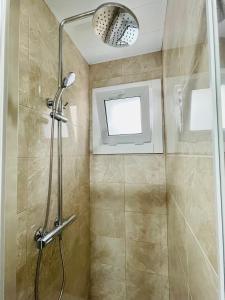 a shower with a glass door in a bathroom at Barca 1 in Barcelona