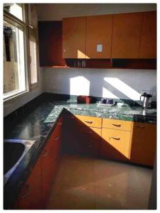 a kitchen with a counter top and a sink at Modern 2 bedroom apartment Near Nainital and Kaichi Dham SF4 in Nainital