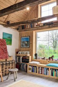 a room with bookshelves and a large window at Apartments with parking space Plaski, Velebit - 21935 in Plaški