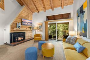 a living room with a couch and a fireplace at Carnelian Woods # 59 - 2 BR Carnelian Bay Retreat - Minutes to Lake w HOA Amenities in Carnelian Bay