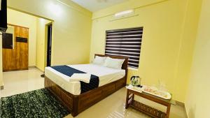 Katil atau katil-katil dalam bilik di Mystique Inn Wayanad