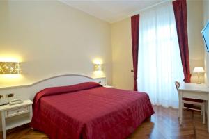 Voodi või voodid majutusasutuse Hotel Excelsior Splendide toas