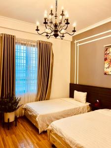 Giường trong phòng chung tại Mộc Hương Hotel