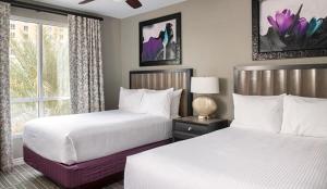 Giường trong phòng chung tại Las Vegas! Mediterranean Style Vacation Retreat