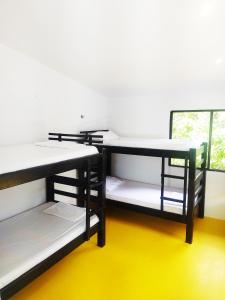 Postel nebo postele na pokoji v ubytování Amalaya Hostel