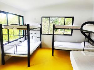 Postel nebo postele na pokoji v ubytování Amalaya Hostel